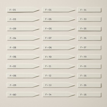 Scent strips laid out in a grid, each marked with a different formula number