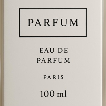 Close view of a perfume bottle label with minimal text