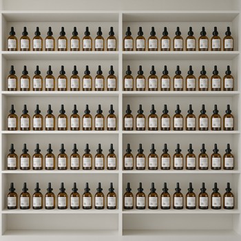 Wide view of perfume raw material shelves in the atelier